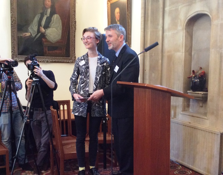 Sophia accepting her prize from Martyn Percy, Dean of Christ Church College